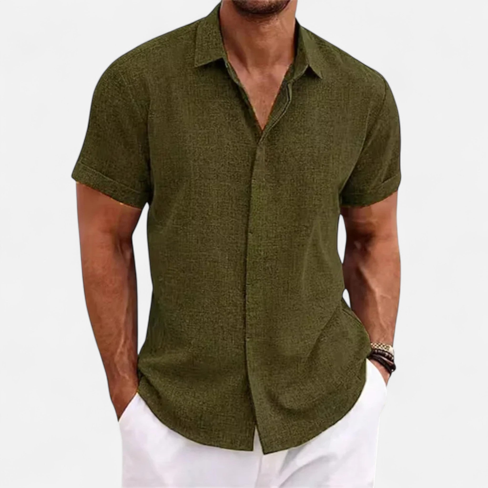 Man wearing a green short-sleeve shirt on a white background