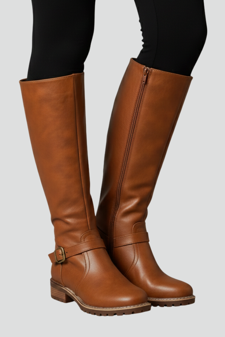 Brown knee-high boots on a plain background