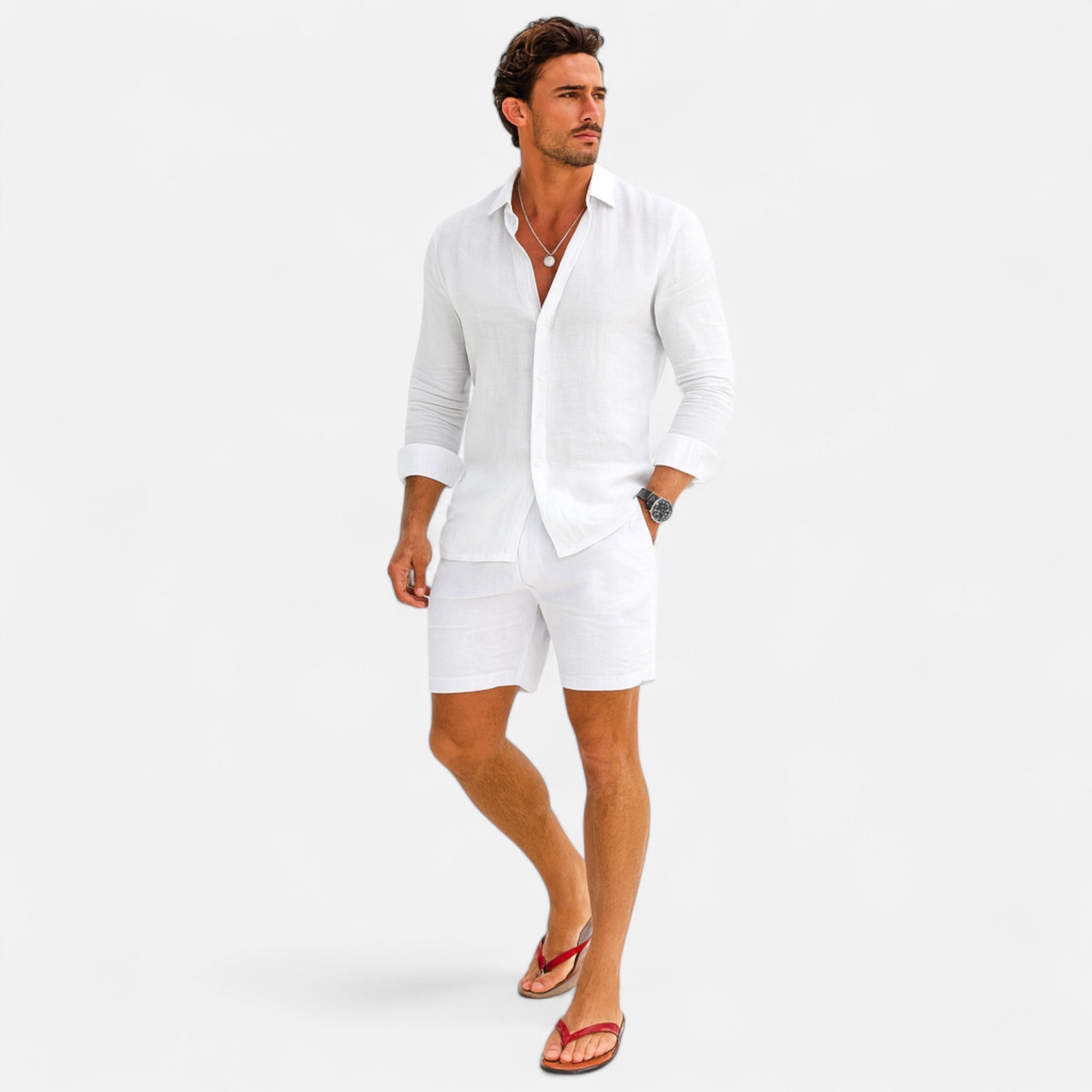 Man wearing a white outfit with red sandals on a white background