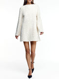 White textured dress worn by a model on a white background