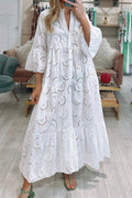 Woman wearing a white lace dress in a store setting