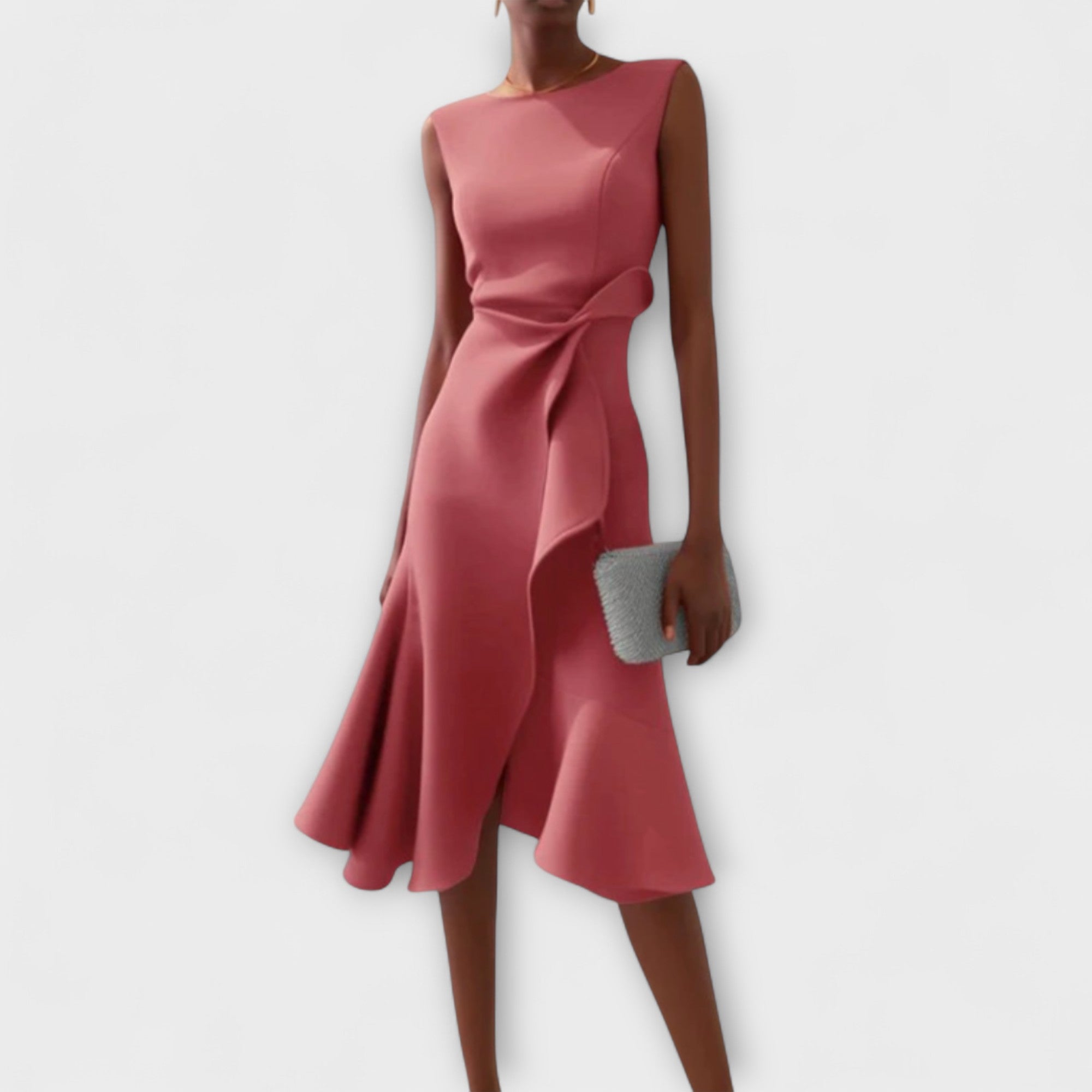 Pink dress worn by a person on a white background