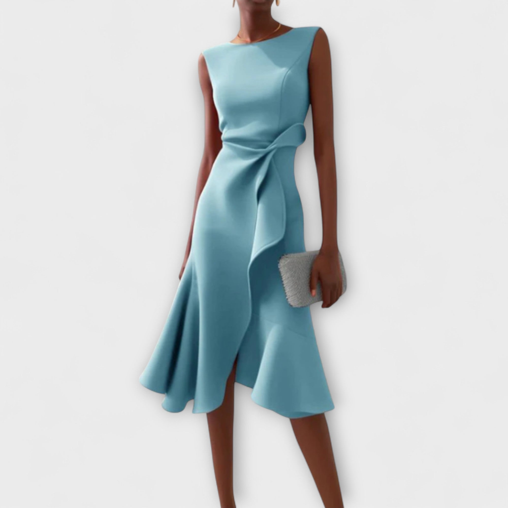 Teal dress with a bow detail on a white background