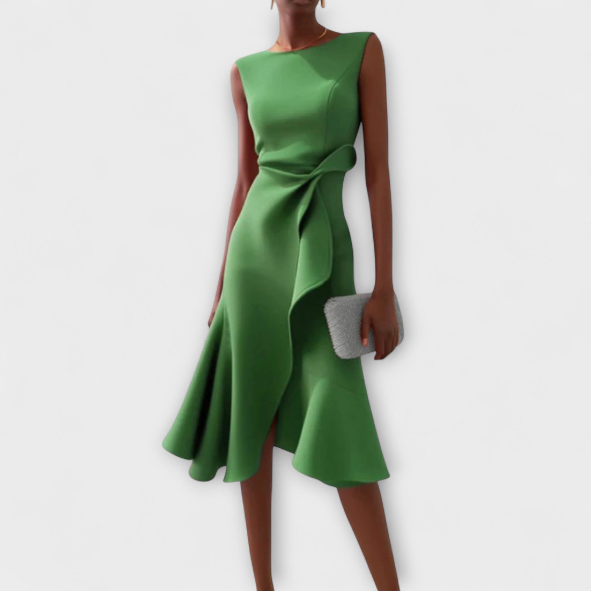 Green dress worn by a model on a white background