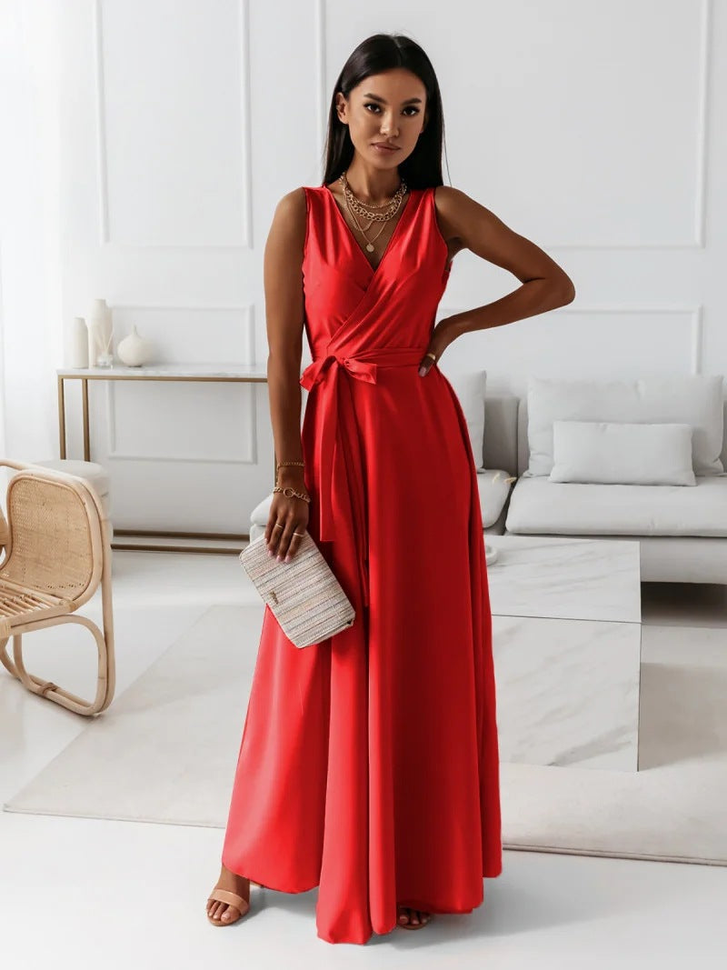 Woman in a red dress standing in a modern living room.
