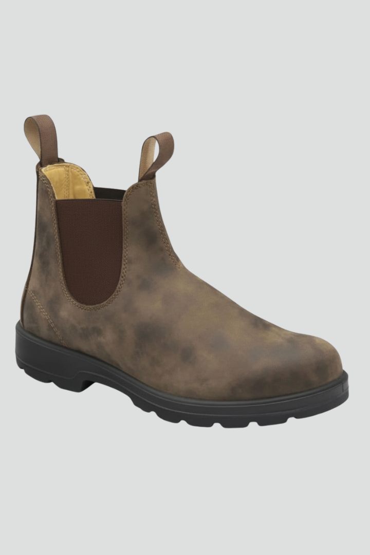 Brown Chelsea boot on a light gray background