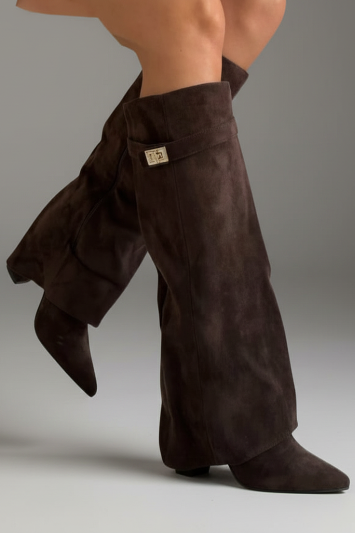 Brown suede boot covers on a neutral background