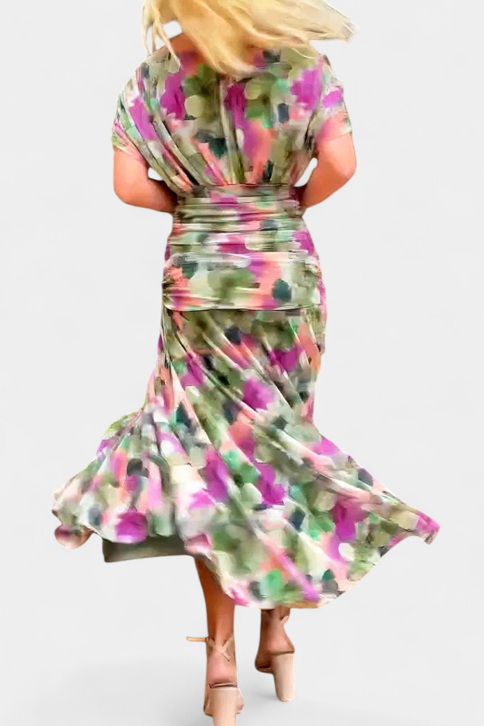 Woman wearing a colorful floral dress on a white background