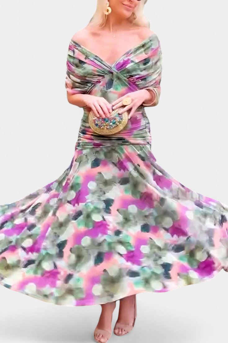 Woman wearing a colorful floral dress with a white background