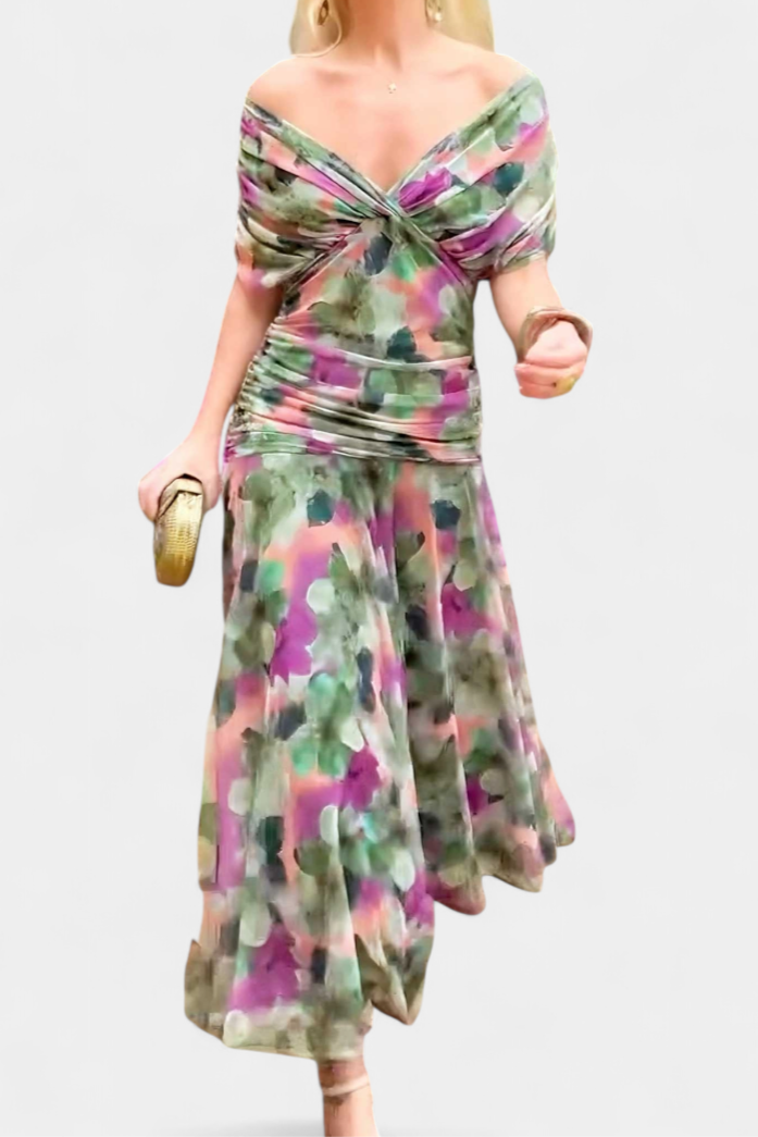 Woman wearing a colorful floral dress on a white background