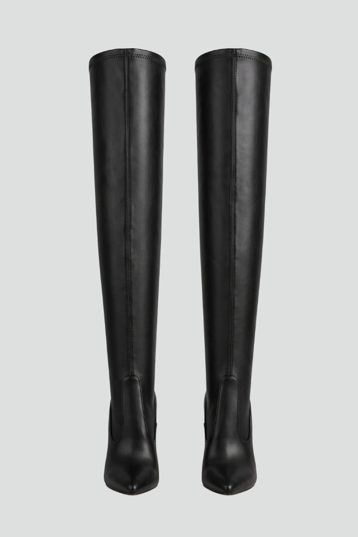 Black knee-high boots on a light gray background