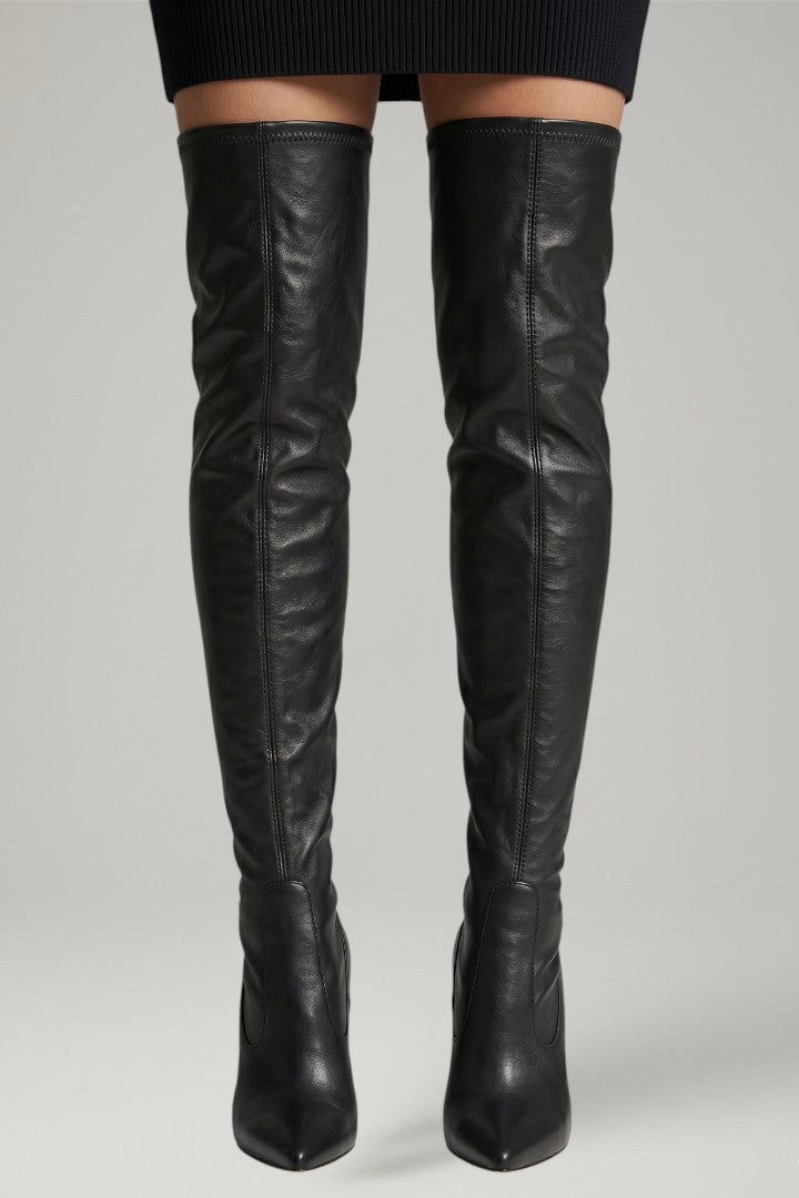 Black leather knee-high boots on a plain background